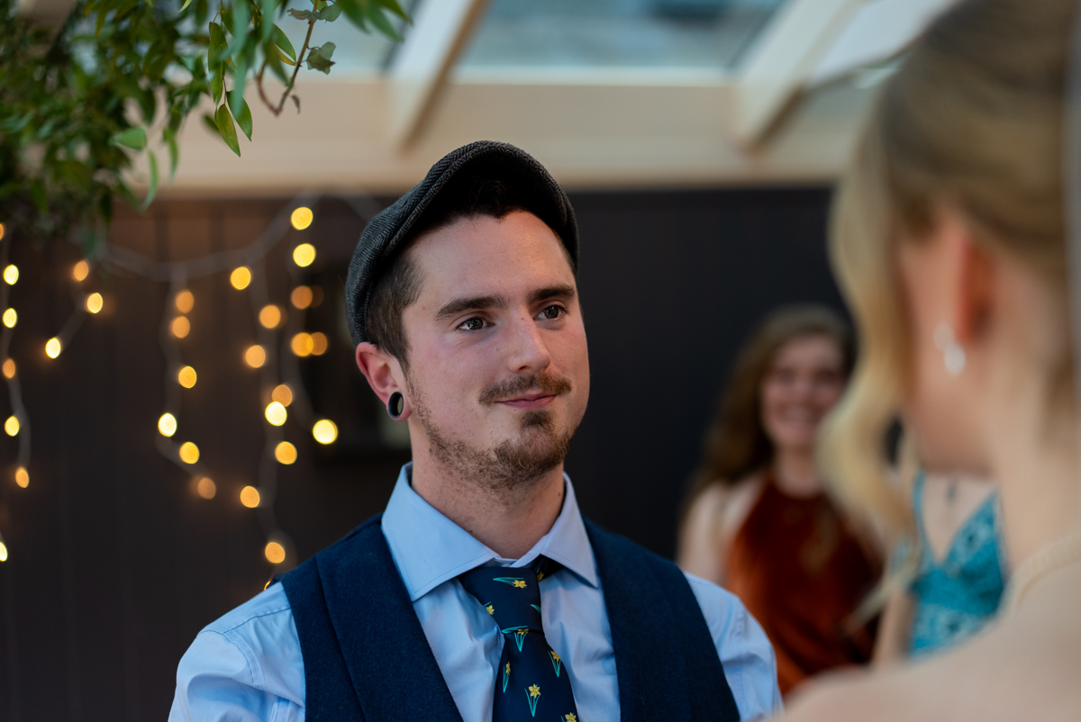 Groom looking at his bride during the wedding vows at an Oxfordshire ceremony