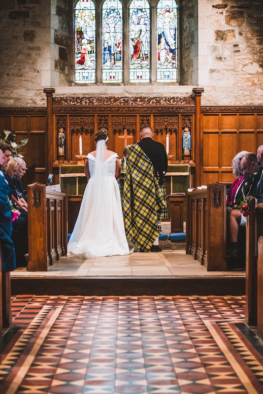 Bride and groom during a church wedding ceremony in Cornwall