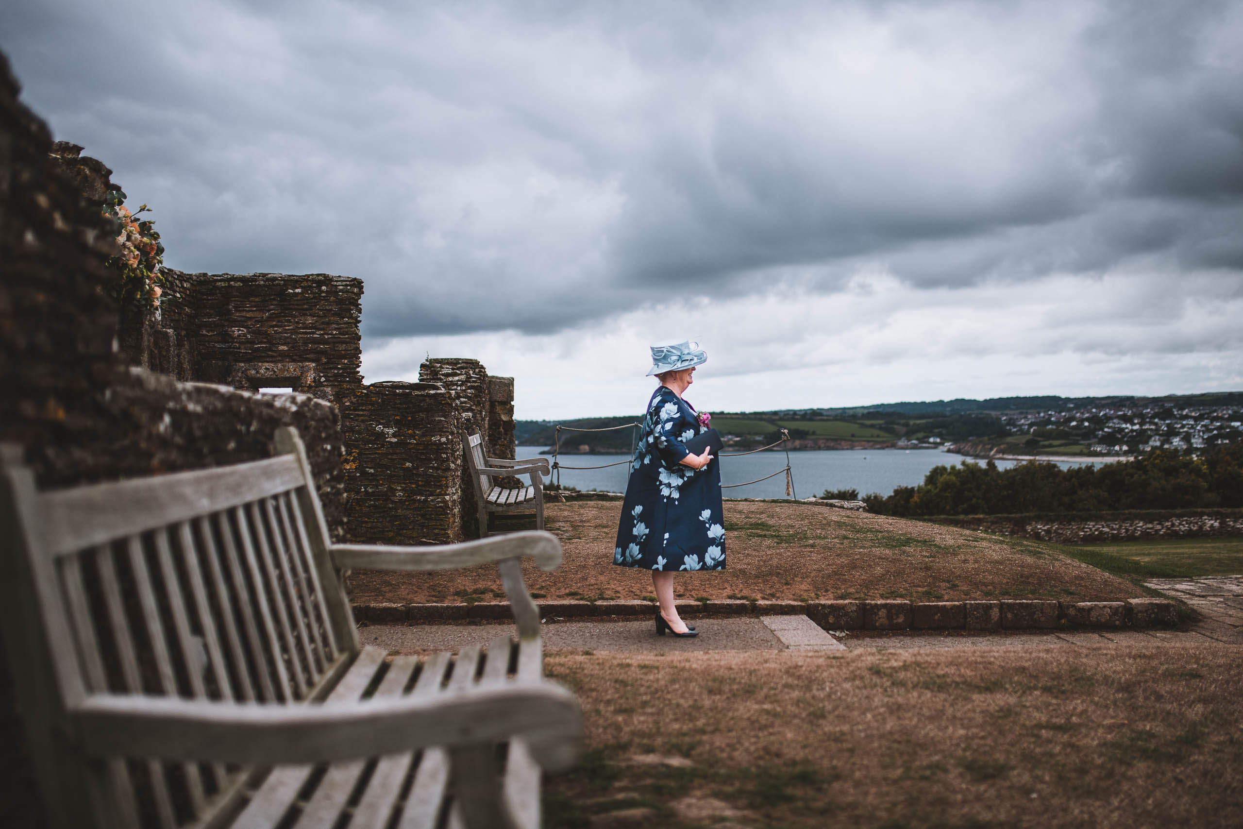 A mother in law searching for the couple during a coastal elopement photography uk session.