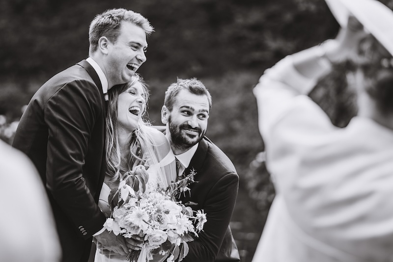 A high-contrast documentary wedding photograph at a Berkshire estate, capturing the unscripted energy of the rural record.
