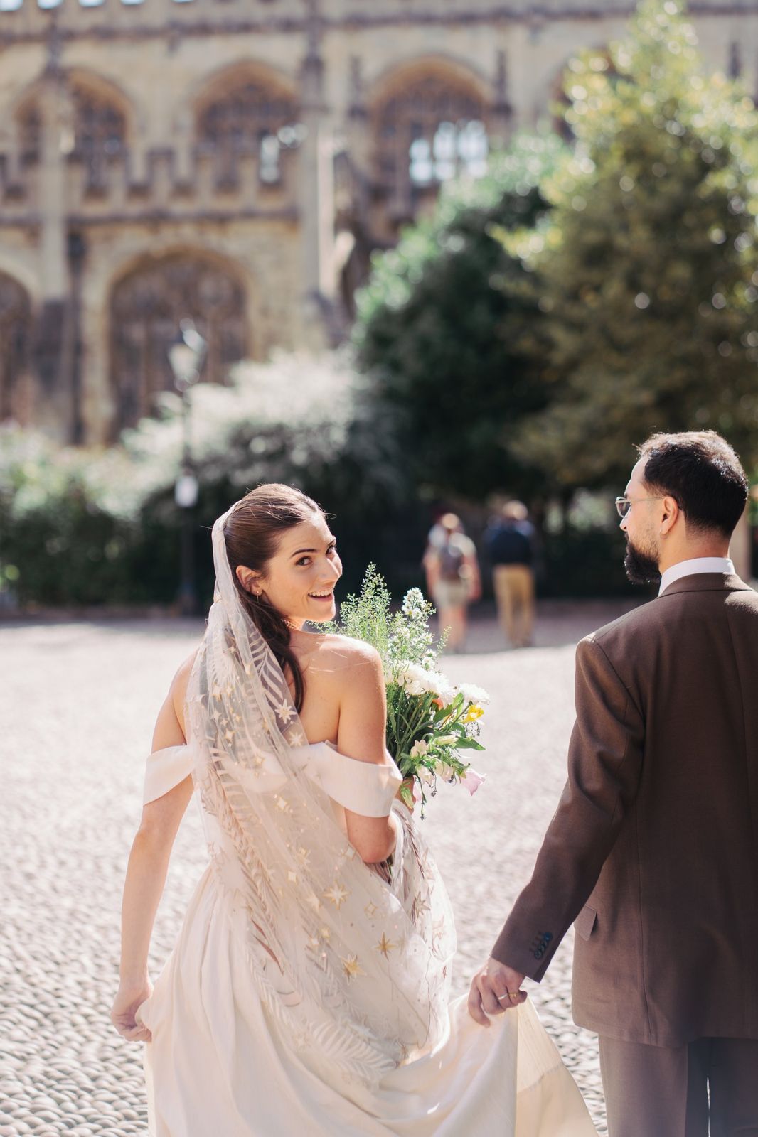 Couple walking through Radcliffe Square, Oxford