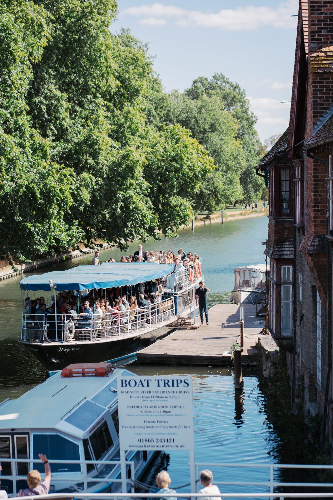 Wedding guests on a riverboat at Folly Bridge, Oxford