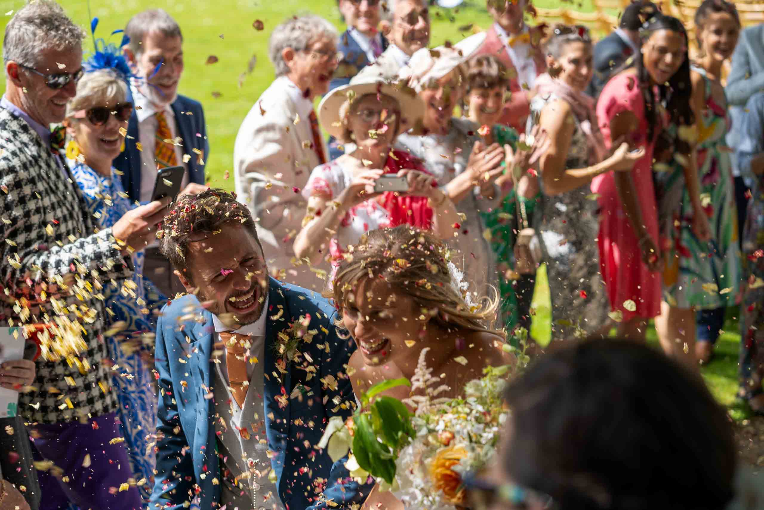 A high contrast confetti shot captured by an Oxfordshire wedding photographer.