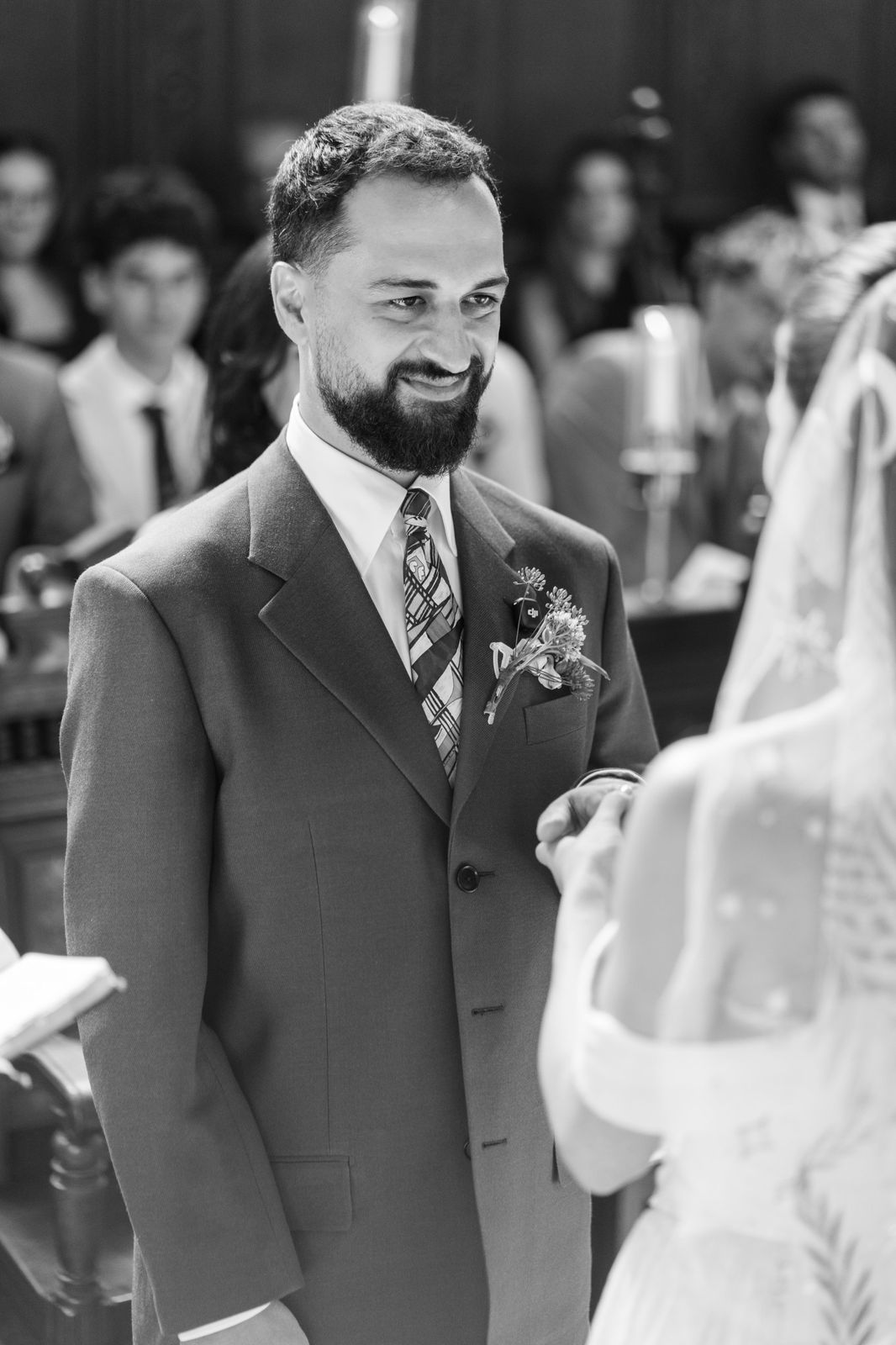 Groom during the vows at Wadham College, black and white