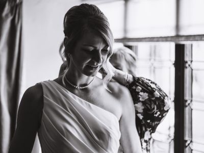 Documentary wedding photography in high contrast showing an unscripted moment.